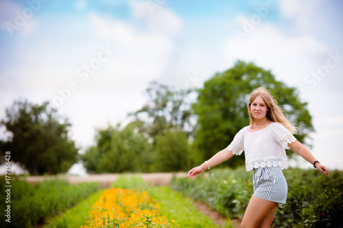 beautiful woman in the field of flowers