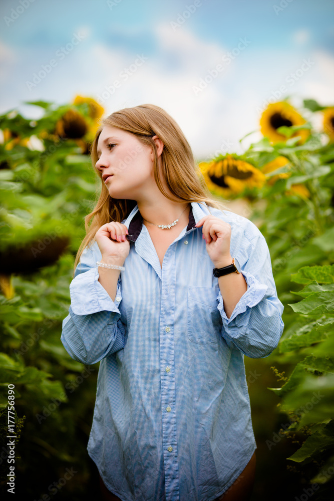 beautiful young woman in field of sunflowers beautiful young woman in field of sunflowers