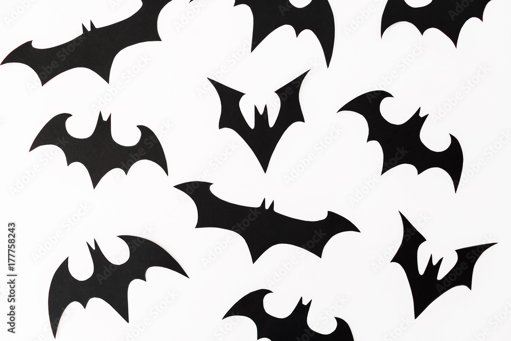 Fototapeta premium Halloween homemade paper black bats isolated on white background. Flat lay, top view.