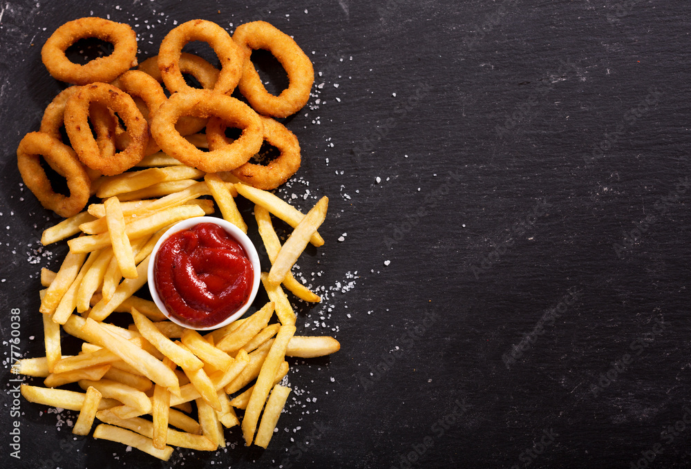 onion rings and french fries with ketchup Stock-Foto | Adobe Stock