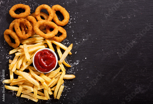 onion rings and french fries with ketchup