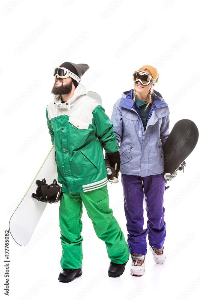 couple in snowboarding costumes with snowboards couple in snowboarding costumes with snowboards