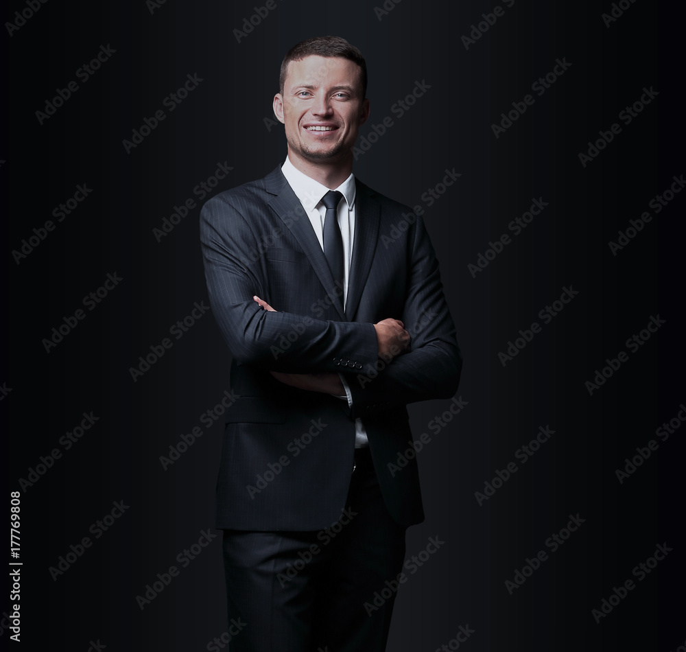 Handsome business man smiling on black background Handsome business man smiling on black background