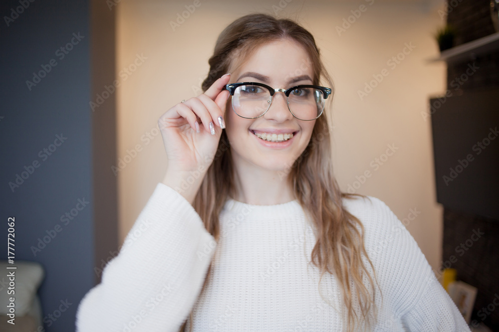 Happy and beautiful girl with glasses and braces. Joyful and surprised face  Stock Photo | Adobe Stock