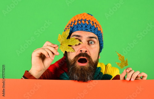Fall season and fallen leaves time. Guy with surprised face