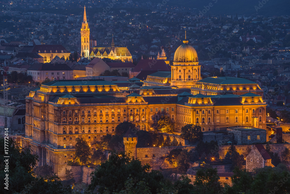 Budapest, Hungary - The beautiful Buda Castle Royal Palace with the Buda hills and the Matthias Church at background at blue hour