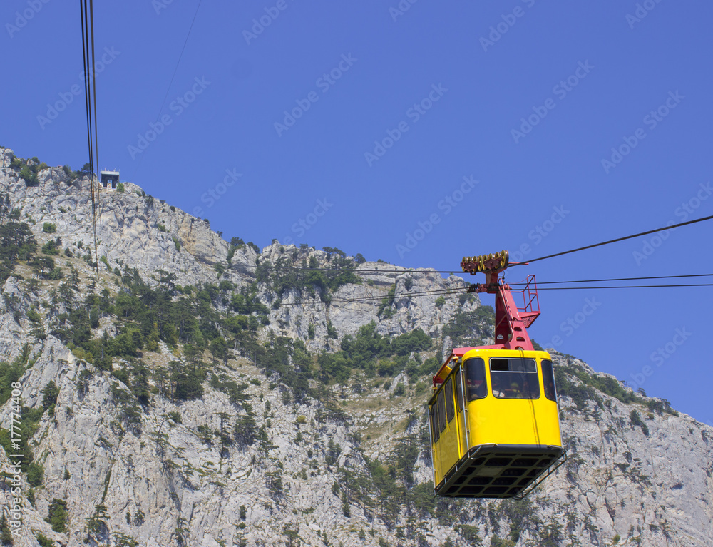cable car cabin on a cable car in the mountains.blue sky and sunny weather