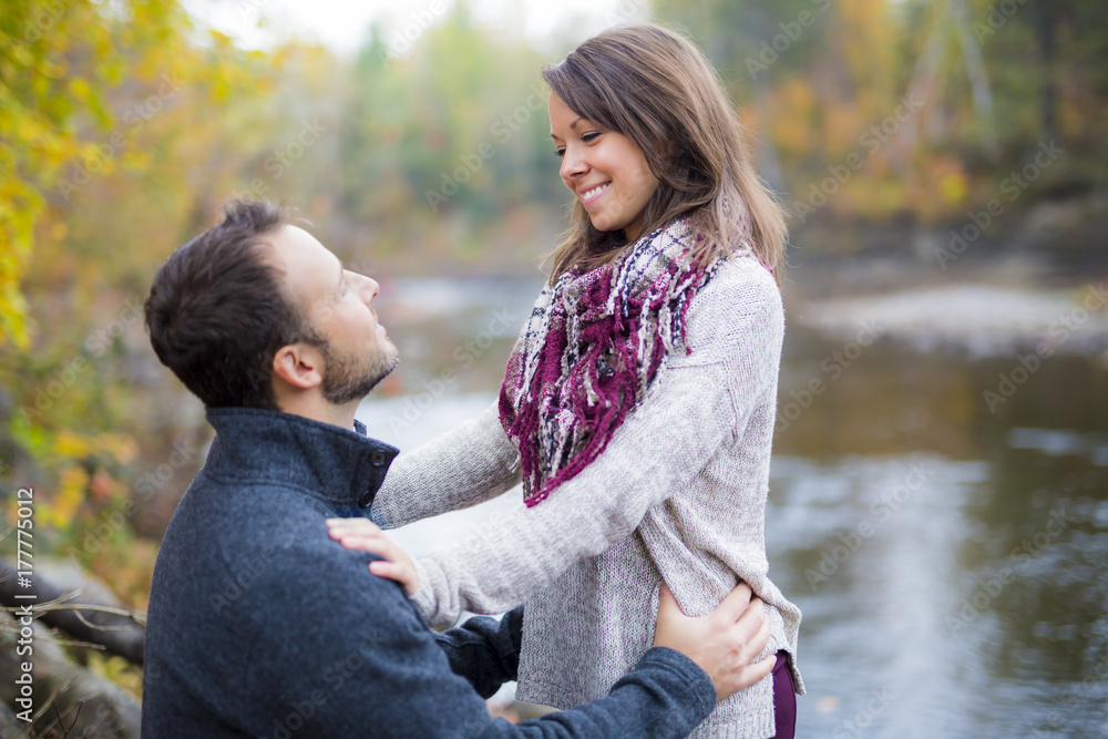 Young couple in love in a park on a autumn day Young couple in love in a park on a autumn day