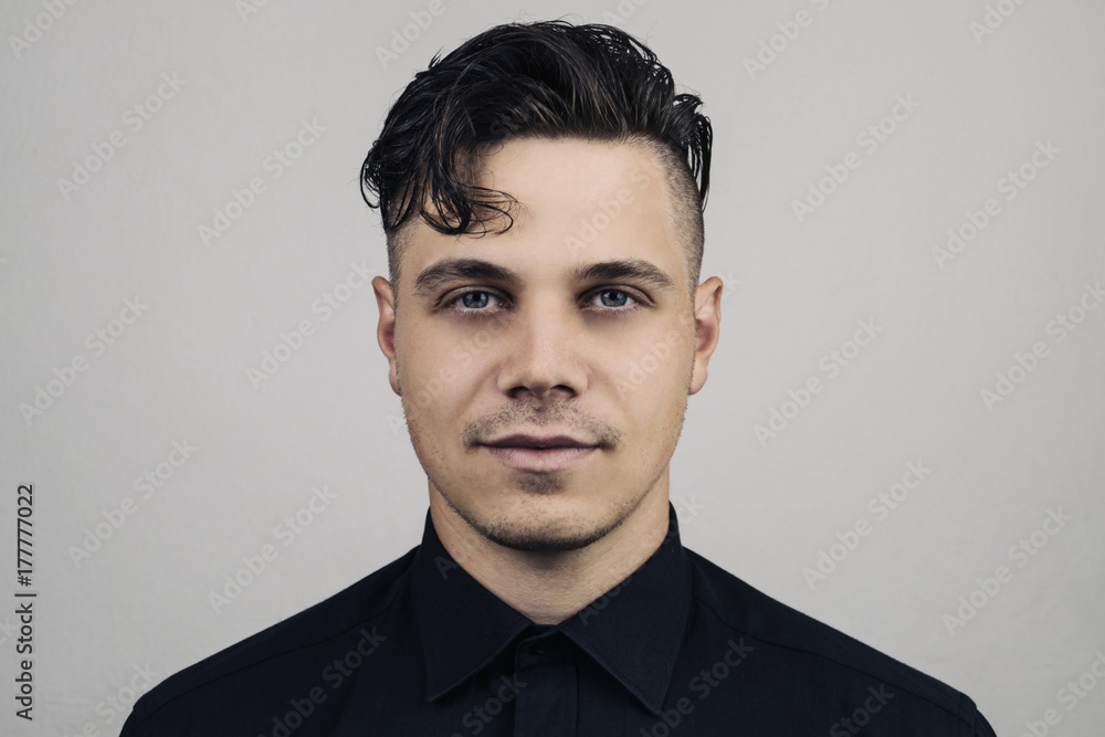 Ταπετσαρία Portrait  of man in formal clothing (shirt) and perfect clean skin on grey background with studion light, Illuminated portrait of handsome male model with modern hairstyle