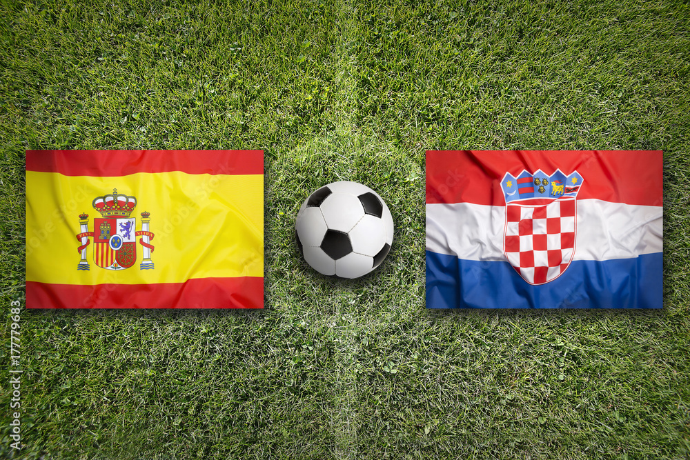 Fototapeta premium Spain vs. Croatia flags on soccer field