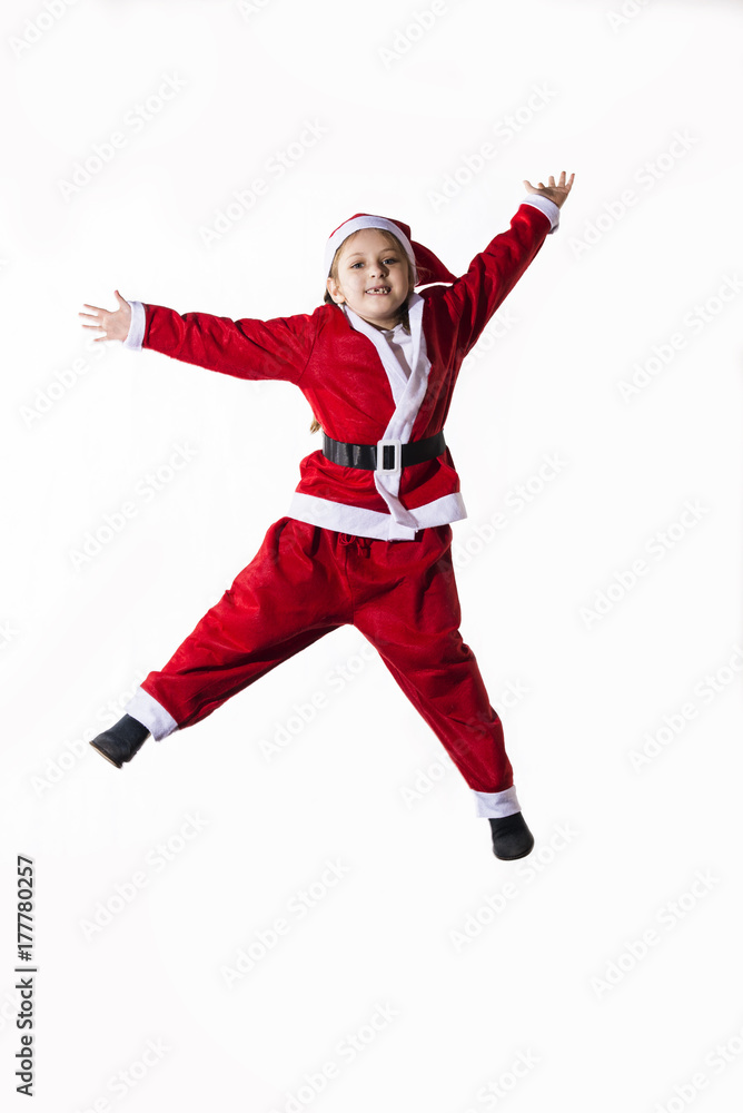 Little caucasian girl dressed as Santa Claus jumping on white background. Little caucasian girl dressed as Santa Claus jumping on white background.