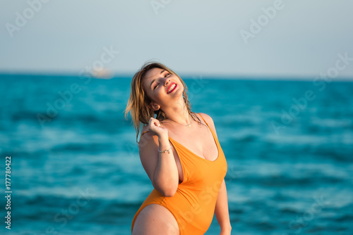 Young woman wear monokini enjoying the sea and the summer