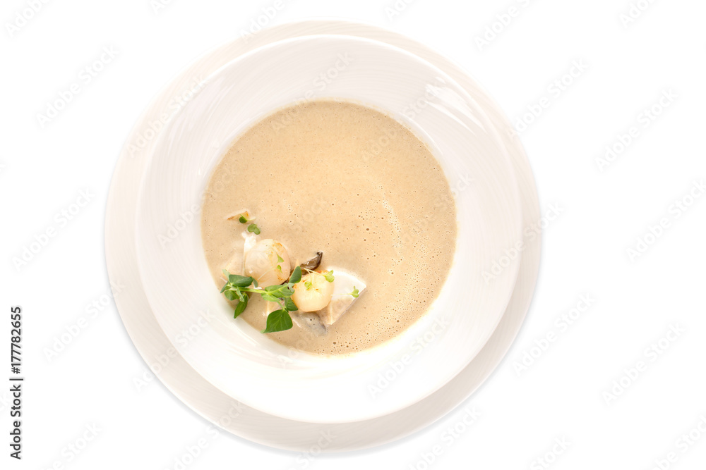 Top view of white ceramic plate with delicious creamy soup isolated on white. Top view of white ceramic plate with delicious creamy soup isolated on white.