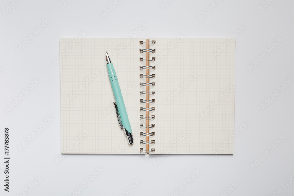 School notebook with stylish green pen School notebook with stylish green pen