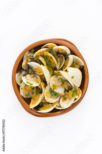 Clams with marinera sauce.Almejas a la marinera. Spanish recipe isolated on white background.Top view