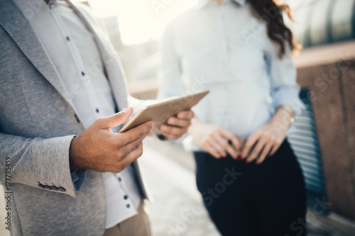 Picture of handsome businessman and attractive businesswoman