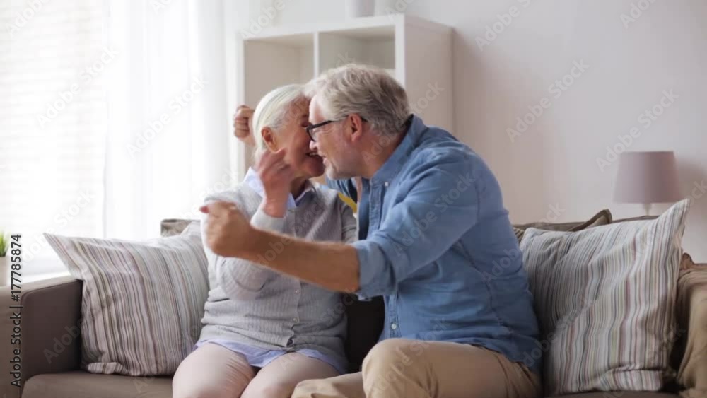 happy senior couple hugging at home happy senior couple hugging at home