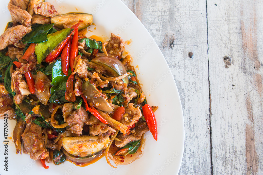 Stir Fried Wild Boar with Red Curry, thai food concept, on wooden table background. Stir Fried Wild Boar with Red Curry, thai food concept, on wooden table background.