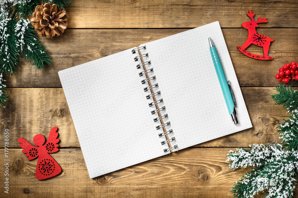 Blank paper notebook on brown wooden table background. Top view with copy space. Blank paper notebook on brown wooden table background. Top view with copy space.