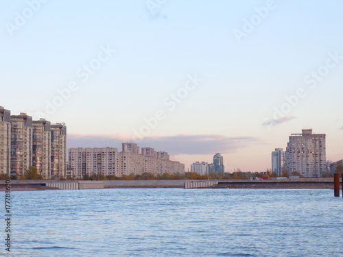 Urban blocks high-rise buildings on the beach at sunset
