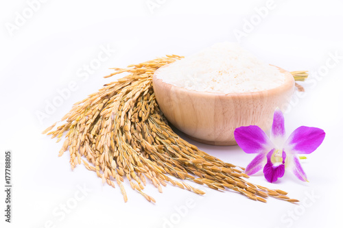 Close up Thai jasmine rice with orchid flower in bowl on white background