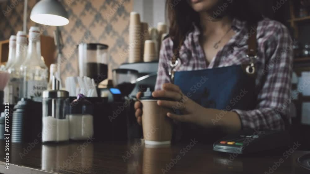 Customer paying NFC with phone at coffee shop Customer paying NFC with phone at coffee shop