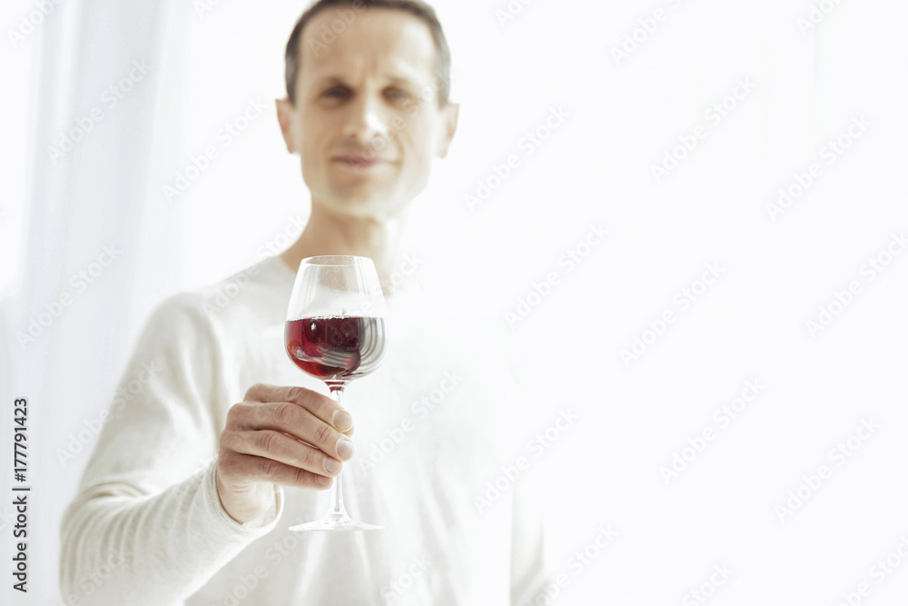 Close up of male hand that holding bocal of wine Close up of male hand that holding bocal of wine