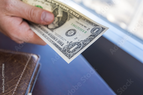 Man giving American Dollar Currency, One dollar bill