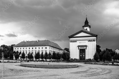 Czechoslovak Army Square with baroque church in Terezin fortress town, Czech Republic. Black and white image. photo