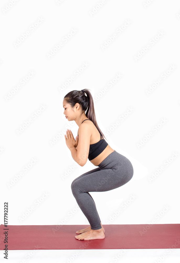 young asian woman doing yoga in Chair with Prayer Hands yoga pose on the mat isolated on white background, exercise fitness, sport training, healthy lifestyle and people concept