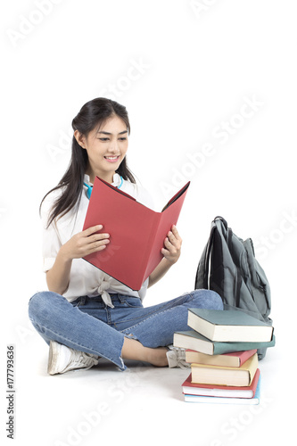 Portrait of Beautiful Young Asian Woman student holding book with attractive smiling isolated on white, Woman with Education Concept. photo