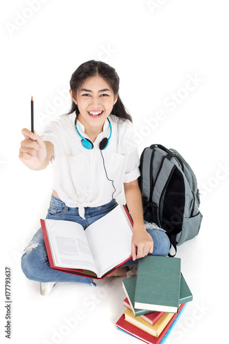 Portrait of Beautiful Young Asian Woman student holding book with attractive smiling isolated on white, Woman with Education Concept. photo