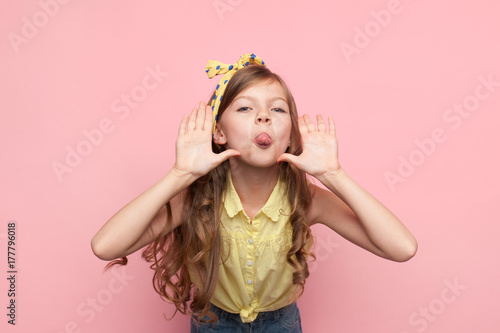 Canvas-taulu Girl showing tongue at camera