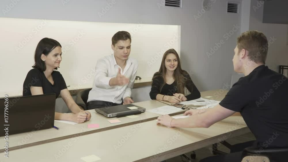 Business team gives five to one another Business team gives five to one another