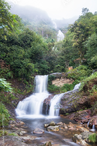 Silver waterfall or Thac Bac on fog in rainy season