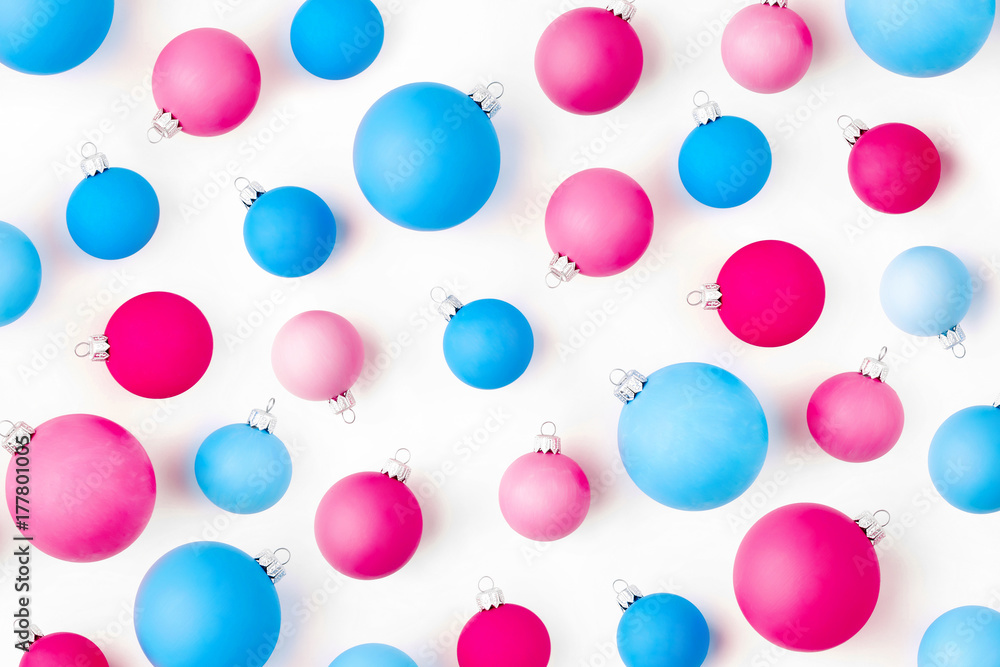 Christmas composition. Pattern made of  blue and pink Christmas balls on wite background. Flat lay, top view
