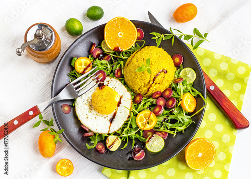 healthy salad plate with quinoa, egg, arugula and citrus photo