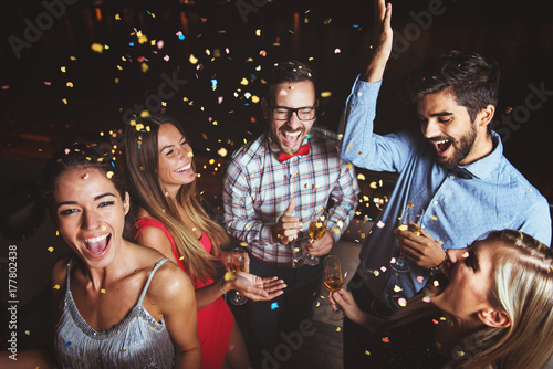 Group of people having a party on the roof celebrating New Year 
