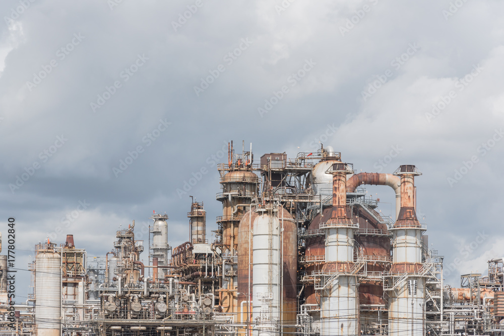 Oil refinery, oil factory, petrochemical plant in Pasadena, Texas, USA under cloudy sky.