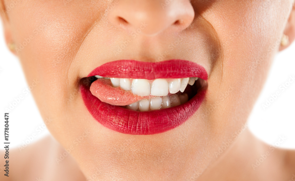 Obraz premium Seductive lips biting tongue