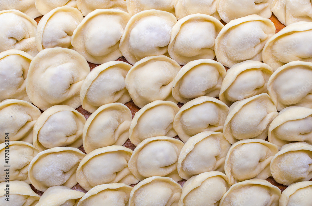 Fototapeta premium Fresh homemade raw dumplings background texture