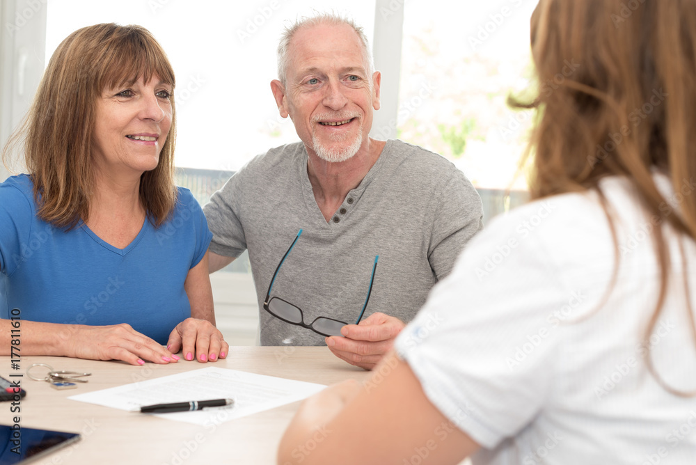 Senior couple meeting financial adviser Senior couple meeting financial adviser