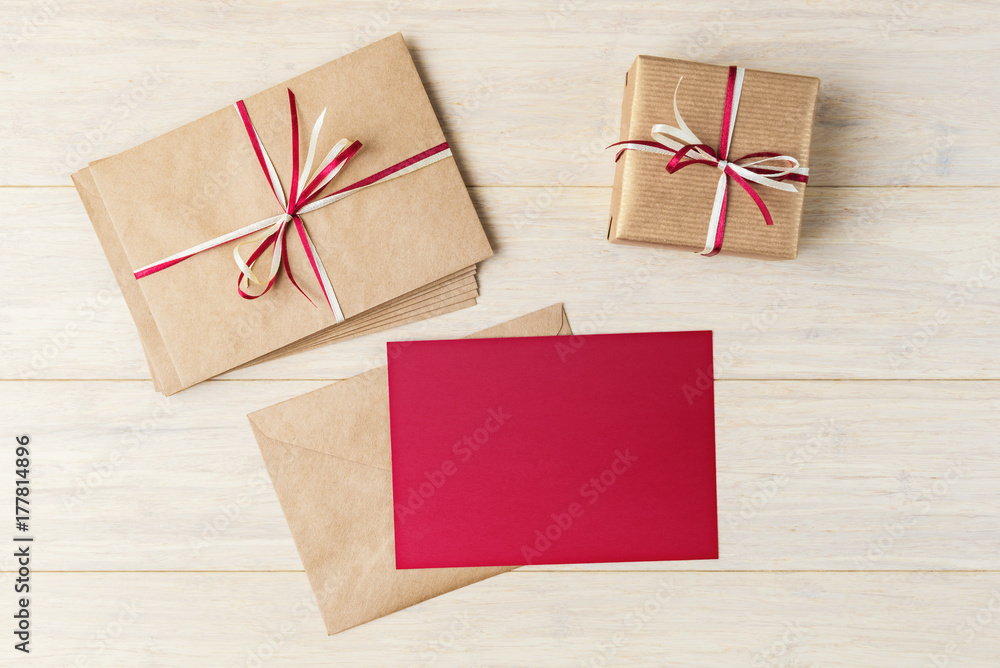 Blank red card mock up with envelopes and gift box Blank red card mock up with envelopes and gift box