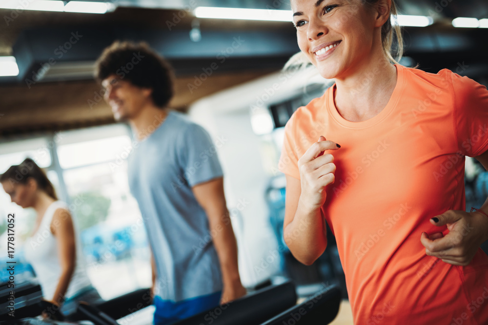 Young attractive woman doing cardio training in gym Young attractive woman doing cardio training in gym