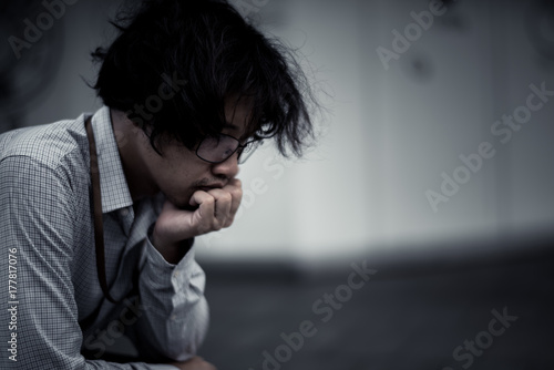 business man is stressed from his work. depression and anxiety concept.