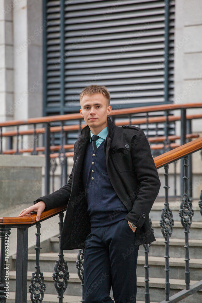 guy in business style clothes on stairway background. Stylish guy. guy in business style clothes on stairway background. Stylish guy.