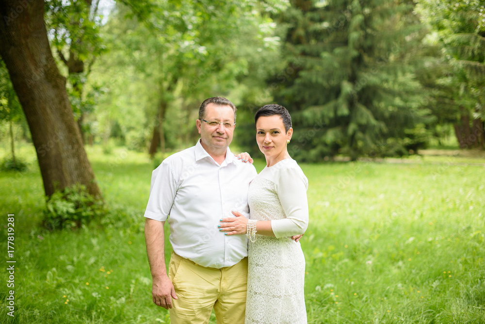 Portrait Of Happy Family In Garden Portrait Of Happy Family In Garden