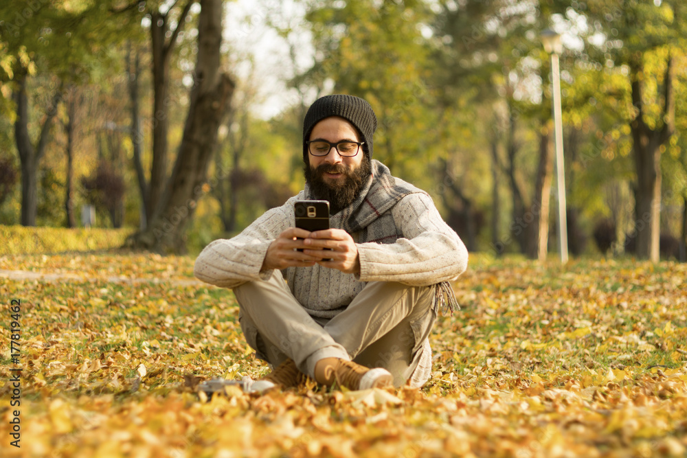 Handsome Man Using Mobile Smart Phone Outdoors Handsome Man Using Mobile Smart Phone Outdoors