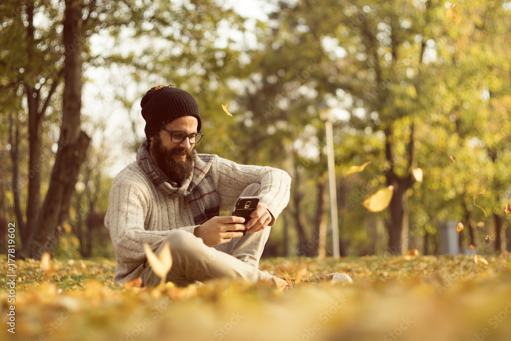 Handsome Man Using Mobile Smart Phone Outdoors