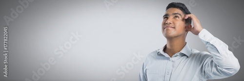 Businessman thinking with grey background photo